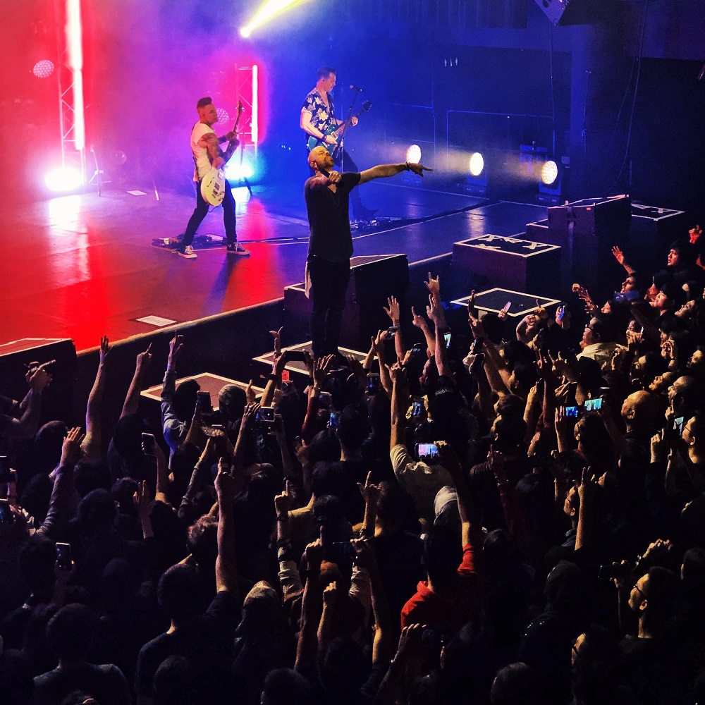 Rojak Daily This picture of Chris feeling the crowd just shows how much he loves performing live.
